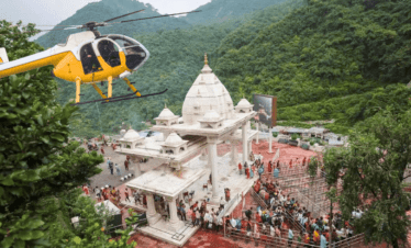 vaishno devi main entrance and a flying helicopter also devotees can perform Vaishno devi helicopter online booking