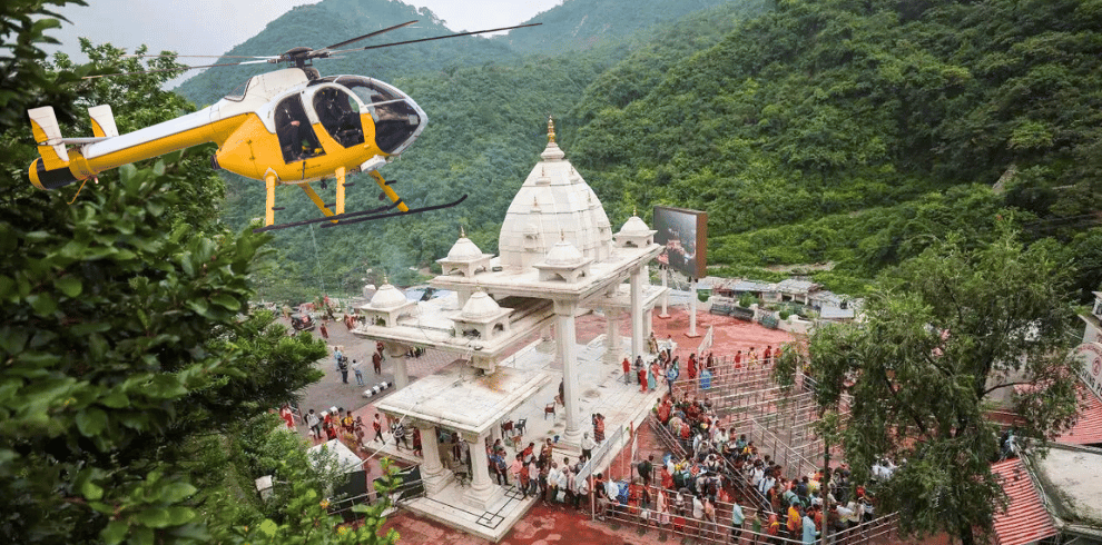 vaishno devi main entrance and a flying helicopter also devotees can perform Vaishno devi helicopter online booking